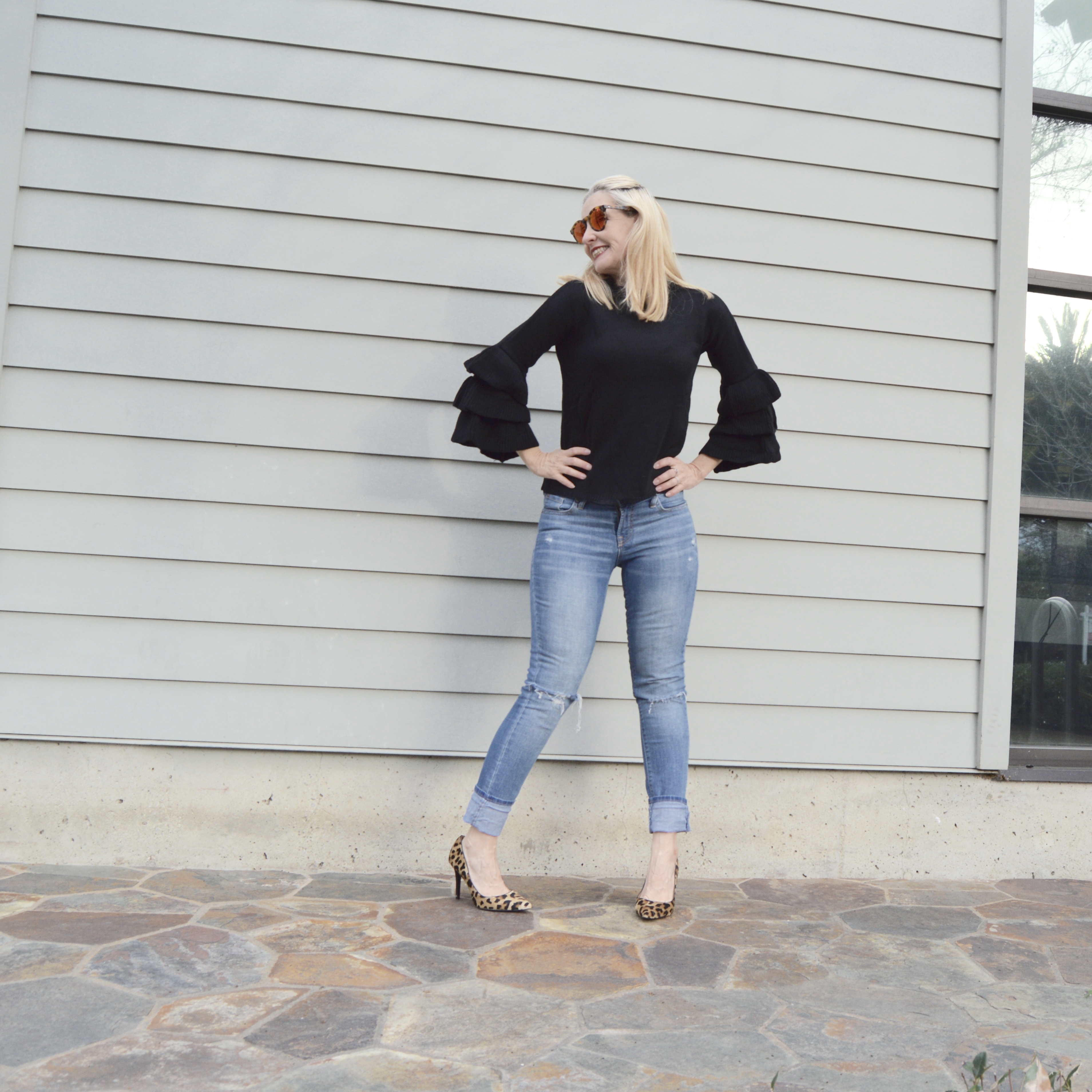 style blogger over 40 styling ruffle sleeve trend