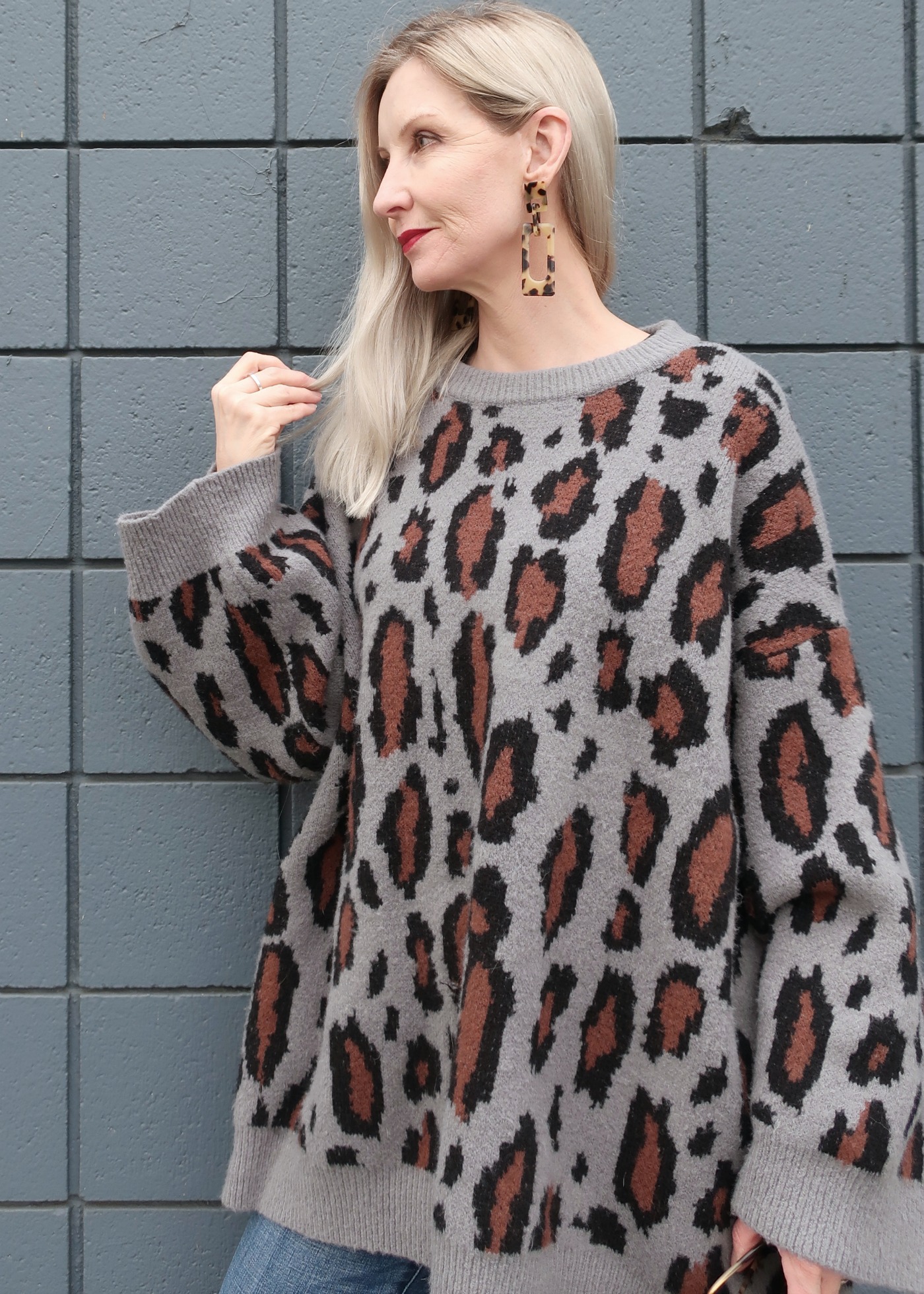 leopard sweater and tortoise earrings make this look pop